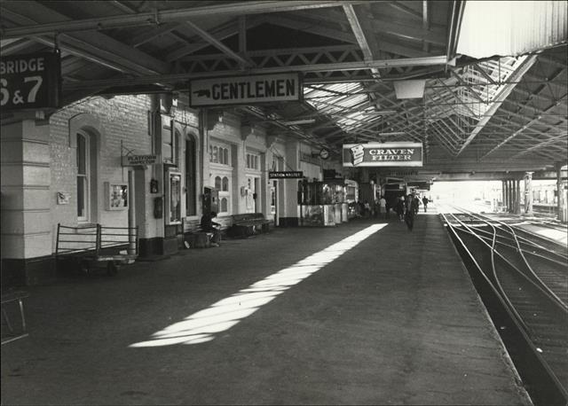 View down length of platform 2 showing offices & businesses