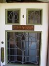 Detail to front door. Note original name plate, door handle and leadlights