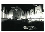 Interior view of chancel over pews