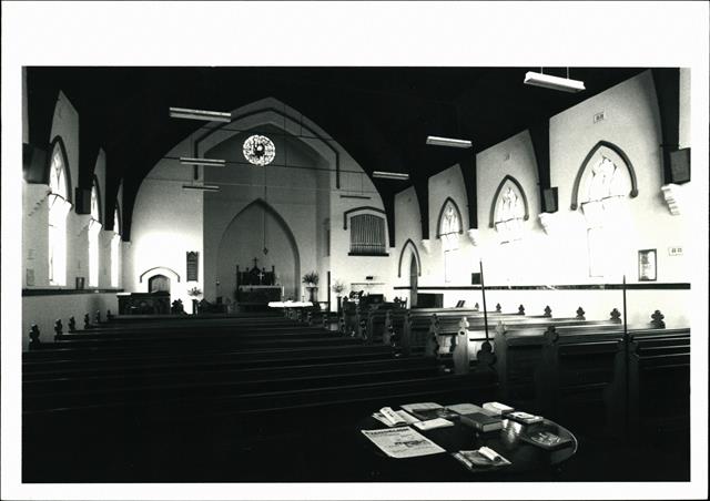 Interior view of chancel over pews