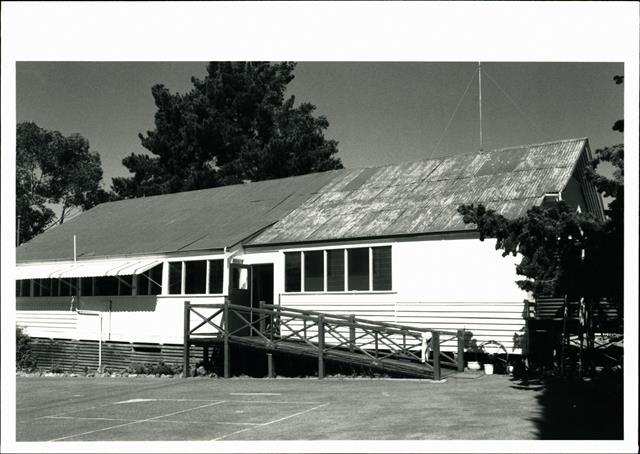 Side view of school building showing contrast between old & new portions