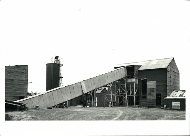 Front view of the entire conveyor building and full length of the belt