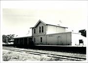 Elevation showing the station platform and signage, rails in foreground