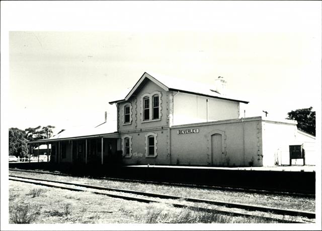 Elevation showing the station platform and signage, rails in foreground