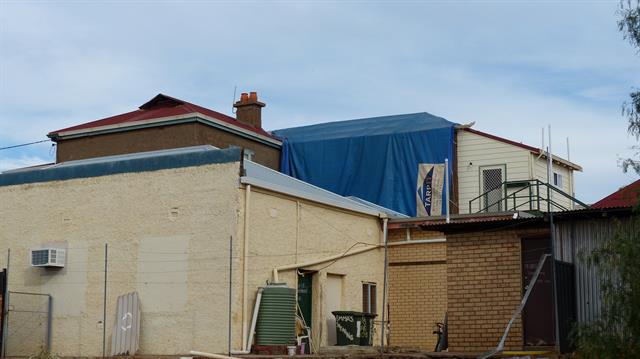 View looking south from rear carpark - tarping to rear roof