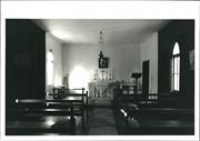 Interior view, facing altar with pews in foreground