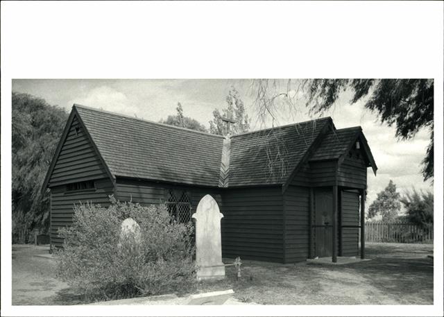 Front corner elevation with gravestones in the foreground