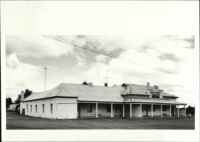 Angled front elevation of building showing later South wing