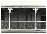 View of balcony showing railing ironwork and posts