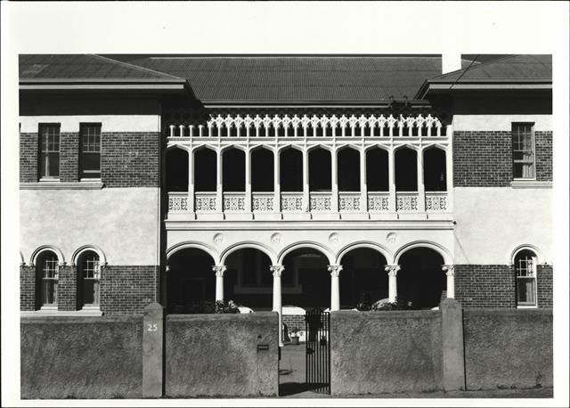 Front elevation of building showing balcony arcature and verandah collumns