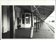 View down length of platform from West with detail of bookstand and verandah pos
