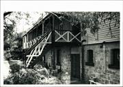 Angled view of hospital rear showing back door