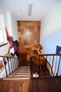Original staircase with original timber veneer wall art behind (2)