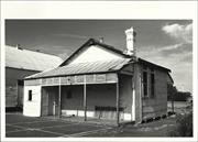 Angled front elevation of schoolhouse