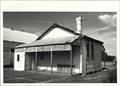 Angled front elevation of schoolhouse