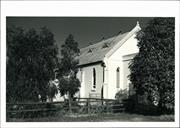 Left corner elevation of church (largely obscured by trees)