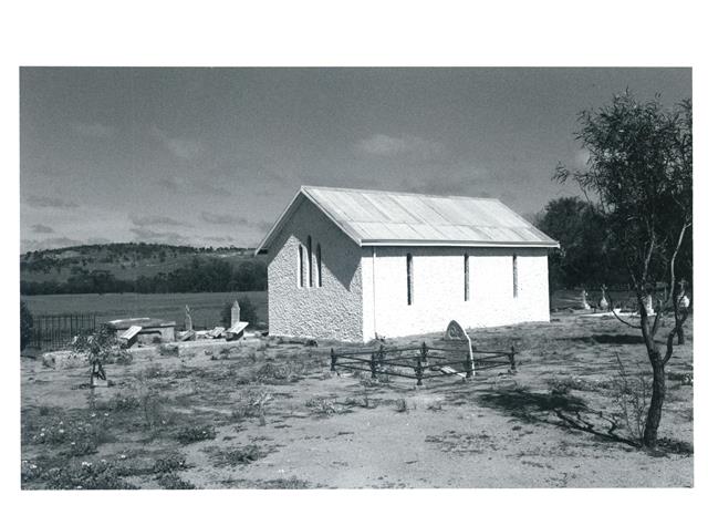 Corner elevation with graveyard surrounding
