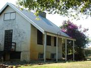 Corner View of Front Elevation showing reconstructed sliding attic doors