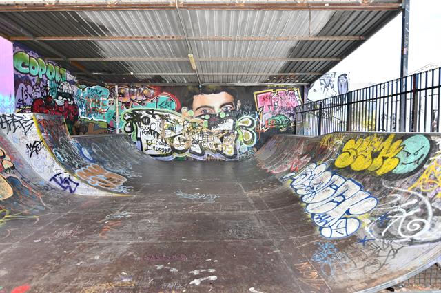 Interior half pipe skate ramps under Shed roof