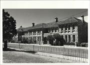 Angled front elevation of building from park across James Street