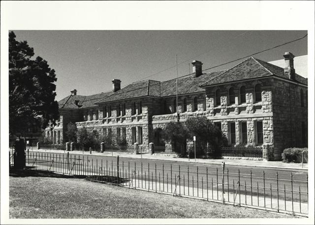 Angled front elevation of building from park across James Street