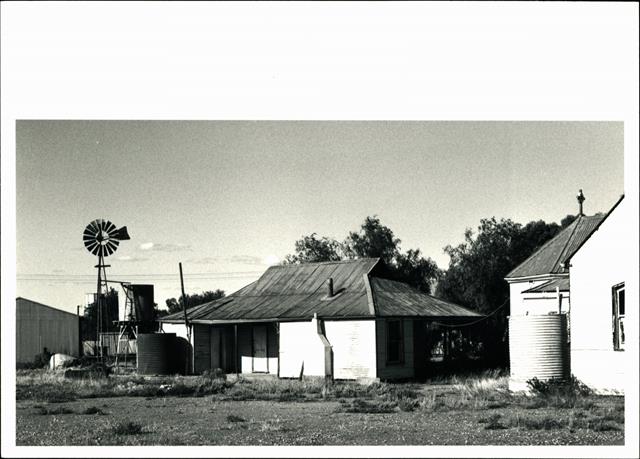 Angled front elevation of presbytery showing church apse on far right