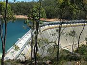 Dam wall during construction of increased height