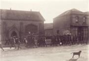 Soldiers marching in front of the ALbany Advertiser