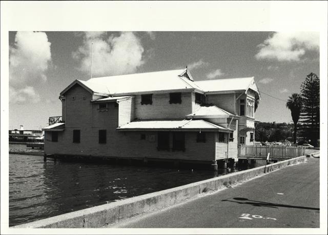 Angled left side elevation of building from foreshore footpath