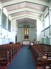 Interior view looking east from entry showing the introduced acoustic ceiling