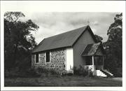 Corner elevation of building showing concrete block addition to front of church