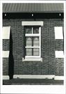 Detail of window on Rowland Street frontage showing buteresses