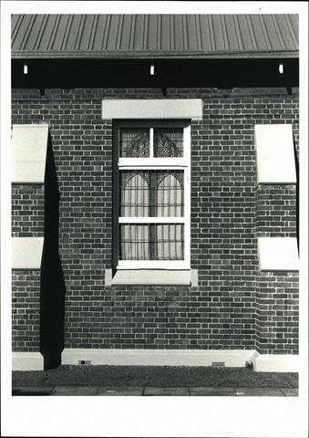Detail of window on Rowland Street frontage showing buteresses