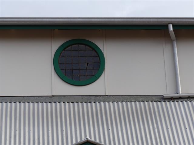 South facing window at western end - damaged