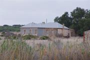 View across paddock showing west elevation