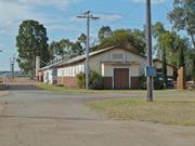 View east showing hut 104 wth 112 & 111 behind