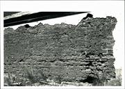 View of Left wall of building showing detail of exposed mud brick construction