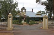 View to house and entrance gates