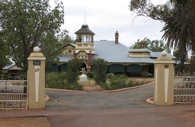 View to house and entrance gates