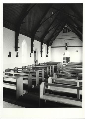 Interior view from East end of church showing pews and entrance