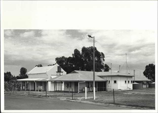 Corner elevation of compound with the old wing on the left and the new wing on t