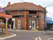 Corner entrance with residence above