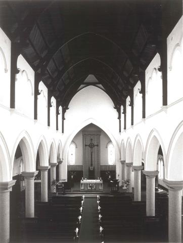 Interior nave, from height showing pews and altar