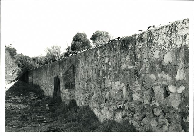 Section of the former limestone perimeter wall