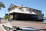 Western side of building shown (cafe in foreground)