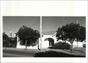 Front elevation of court house (obscured by trees)