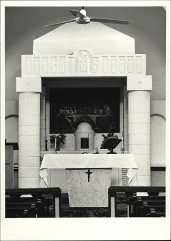Interior view of church showing altar from pews
