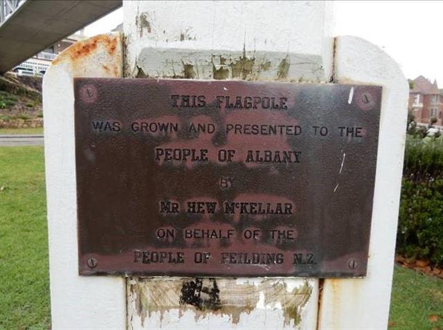 Plaque on flagpole - north-eastern corner of garden