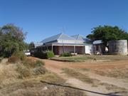 Dr Bartlett's Redidence side elevation with stone water tank