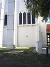 Exterior south elevation showing part of hall and the link between church and ha